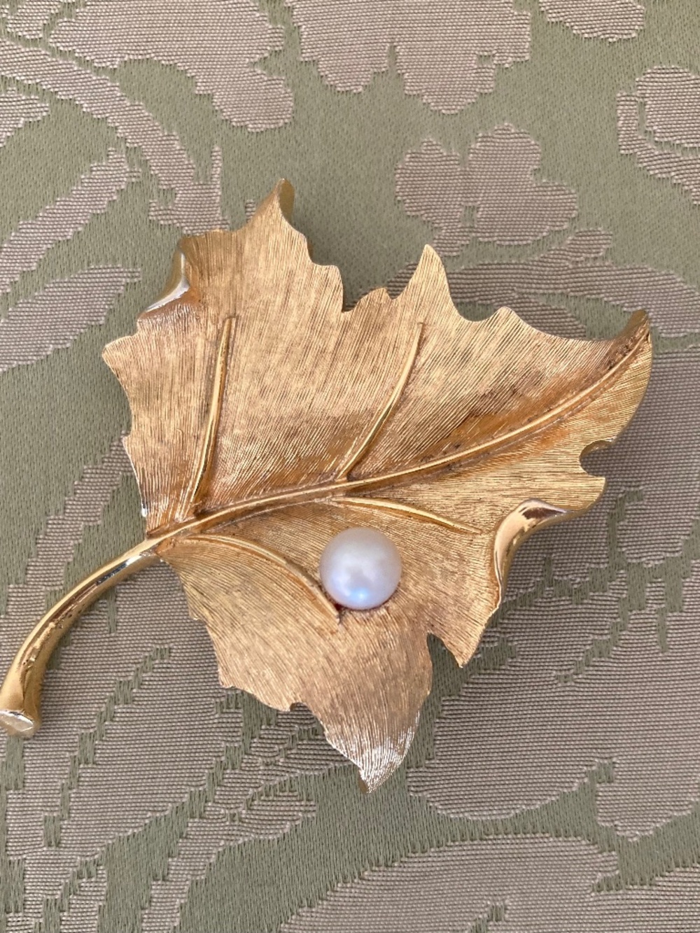 Vintage brooche signed Boucher, maple leave gold plated with faux pearl.